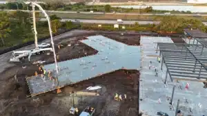 Aerial of a large commercial concrete pour and structural building pad in South Florida
