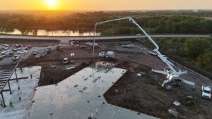 Golden-hour commercial concrete pour with a pump truck in South Florida