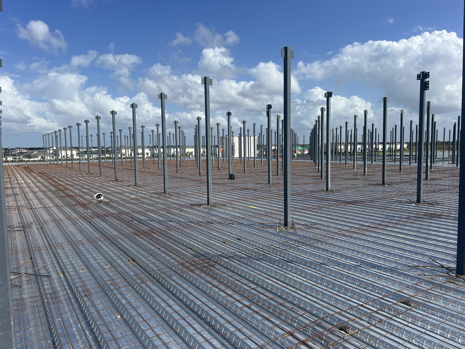 Elevated structural concrete deck on metal decking and steel columns